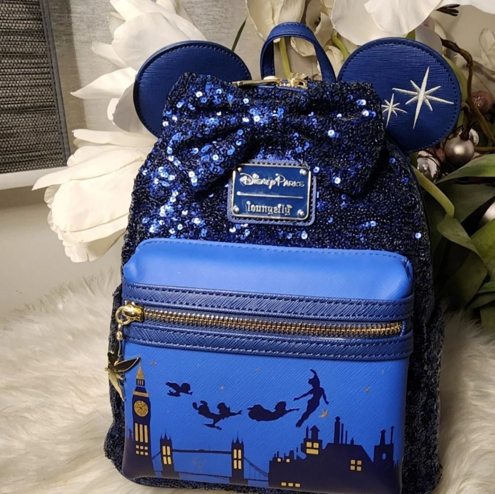Set of 4 Peter Pan Backpack 2pairs of ears& PlushAll of them brand new